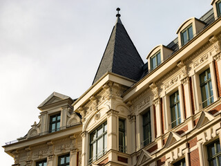 Old architecture with stucco on the exterior wall. Beautiful building facade in an old town in Germany. Close up of a residential house which was restored.