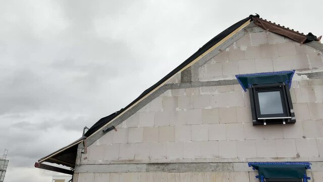 Roof cladding blown by storm in construction. 