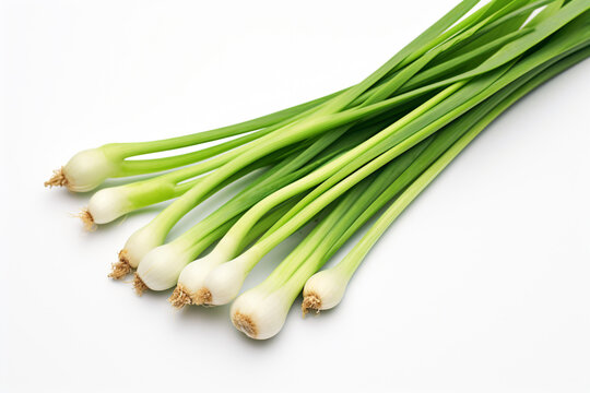 a bunch of green onions on a white surface