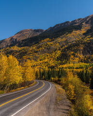 Fototapeta premium American Scenic Road Colorado Million Dollar Highway Scenic Vista Mountain Road in Autumn Yellow Aspen Trees Curved Road