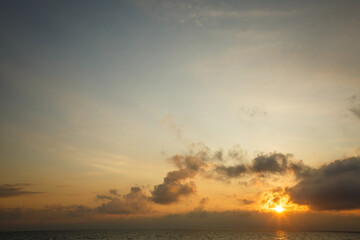 Beautiful sunset near the shore on the sea, background with sunset, orange sunset