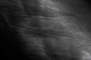 Fototapeta premium Texture of genuine black leather. Leather background with gradient