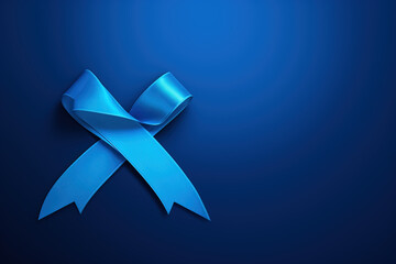 A striking dark blue ribbon on a blue background , raise awareness of colon cancer awareness . - obrazy, fototapety, plakaty