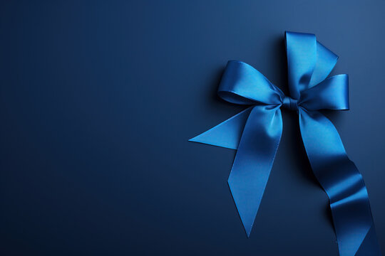A striking dark blue ribbon on a blue background , raise awareness of colon cancer awareness .