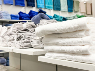 stack of colorful towels on shelves