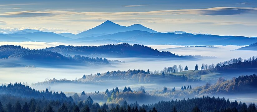 Wooden construction frames misty West Tatras view from Turbacz area in Poland's Gorce Mountains.