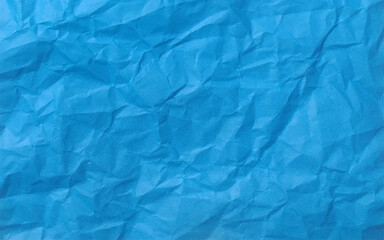 Recycled crumpled blue paper texture or paper background for design with copy space for text or image
