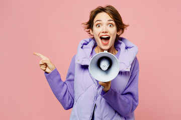 Young woman wears purple vest sweatshirt casual clothes hold in hand megaphone scream announces...