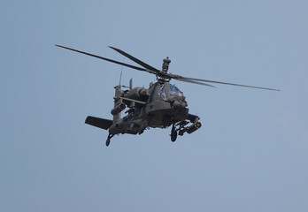 ah-64 apache helicopter in flight	