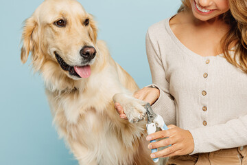 Close up cropped young owner groomer woman with her best friend retriever dog wear casual clothes...