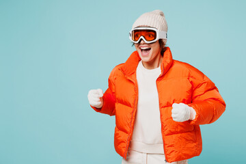 Side view young skier woman wear warm padded windbreaker jacket hat goggles mask pov ski poles and...