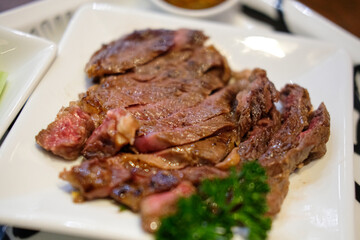 Medium rare steak meat served on plate