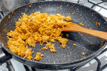 Fried rice with vegetables in a frying pan