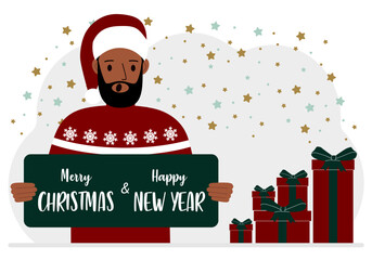 A man in a red cap holds a Merry Christmas and Happy New Year greeting card.