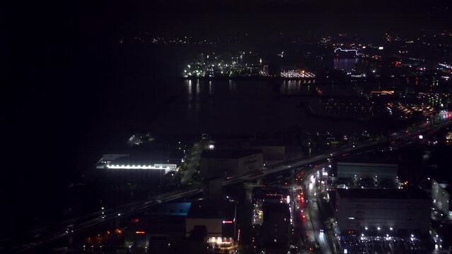 Osaka Kansai international airport bay area at night timelapse aerial view ocean buildings lighting