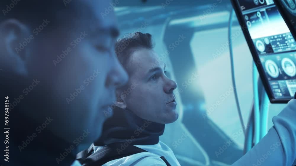 Wall mural team of astronauts in a space suits aboard the orbital station. a crew of cosmonauts piloting the sp