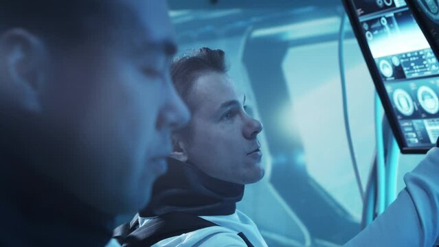 Team of astronauts in a space suits aboard the orbital station. A crew of cosmonauts piloting the spaceship in space. Galactic travel and science.