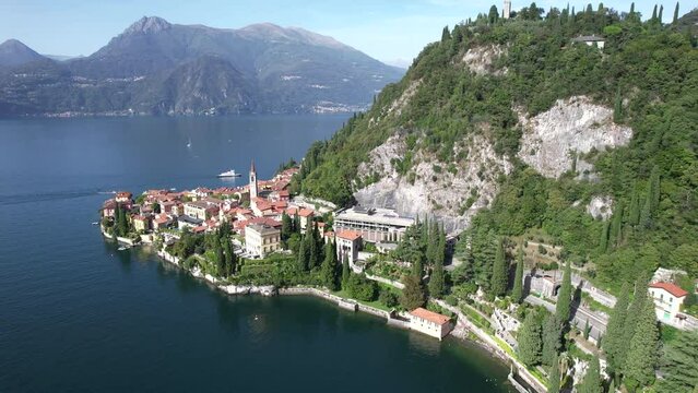 Sunrise flyover above the Italian village of Varenna in Lake Como Italy