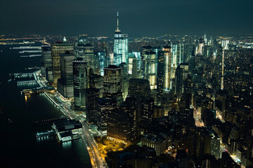 A dark theme that captures the majesty of Manhattan's skyline against the backdrop of the midnight sky, highlighting the city lights and towering skyscrapers