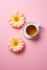 Cup of tea with two light pink flowers on a light pink background in the style of minimalism