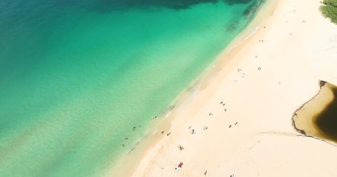 Calm glassy ocean at Waimea Bay, North Shore, Oahu, Hawaii