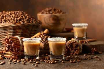 Irish cream and coffee liqueur on a brown background.