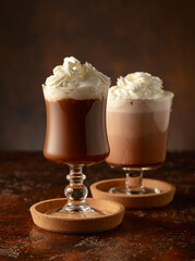 Creamy milk chocolate drinks with whipped cream.