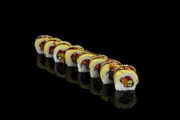 Delicious rolls of Japanese cuisine. Dark background
