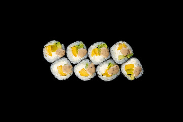 Delicious rolls of Japanese cuisine. Dark background