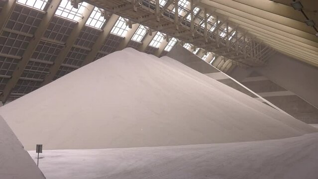 Warehouse for storing white granulated phosphate fertilizers. Warehouse in factory