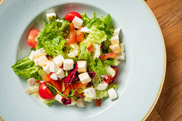 greek salad on the wooden table