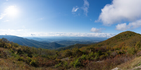 A panorama of a scenic overlook in Shenandoah National Park during fall foliage