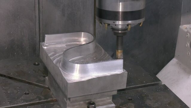 The CNC milling machine cutting mold part by solid ball end mill tool. The mold parts cutting process by machining center with solid ball end mill. The hi-Technology manufacturing process.
