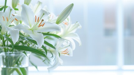  a vase filled with white lilies sitting on top of a window sill next to a window sill.