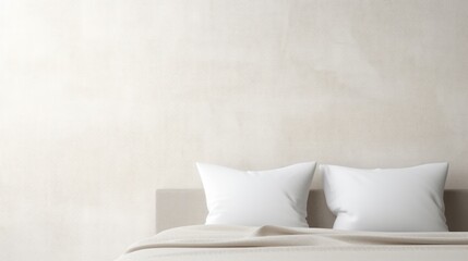 Fototapeta na wymiar two white pillows sitting on top of a bed next to a white pillow on top of a white headboard.