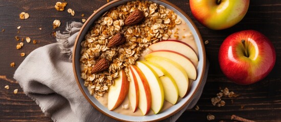 Autumn vegan recipe: Apple pie smoothie bowl, topped with granola and peanut butter. Closeup, top...