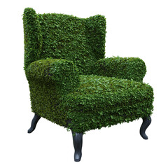 A 3d rendered armchair with overgrown grass as an overlay