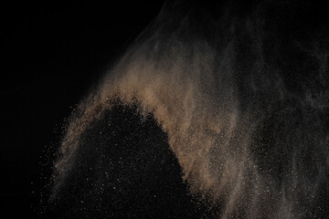 Smoke abstract texture. Cloud of brown ground. Soil explosion on black background. Sand explode.	