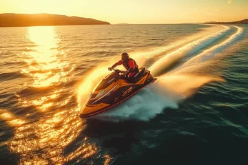 Foto op Plexiglas A man riding a jet ski on top of a body of water. Suitable for recreational water sports or summer vacation themes © Fotograf