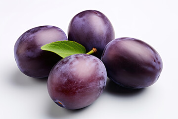Fototapeta premium Plums with leaves on white background