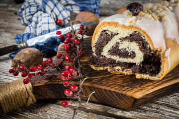 Poppy seed strudel with icing.