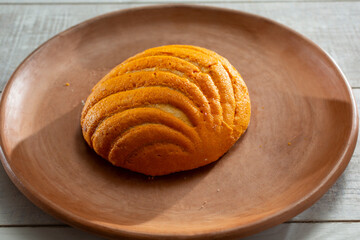 A view of an orange Mexican concha.