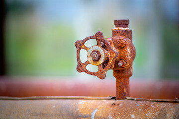 old and rusty faucet of obsolete chemical industrial equipment