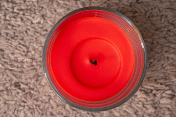 red wax candle with no burning flame