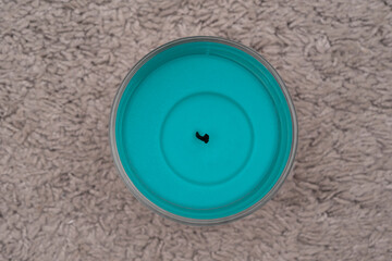 Blue wax candle with no burning flame.