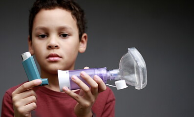 child with flu and inhaler respiratory puff on grey background with people stock image stock photo 