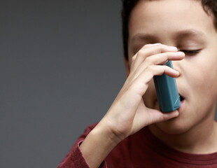 child with flu and inhaler respiratory puff on grey background with people stock image stock photo 