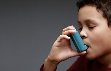 child with flu and inhaler respiratory puff on grey background with people stock image stock photo 
