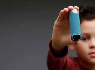 child with flu and inhaler respiratory puff on grey background with people stock image stock photo  - obrazy, fototapety, plakaty