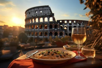 Tuinposter Culinary Flavors in Rome: A Rustic Table at a Cozy Café, Accompanied by Wine - The Majestic Colosseum Provides a Stunning Backdrop to the Sunset Dining Experience. © Mr. Bolota